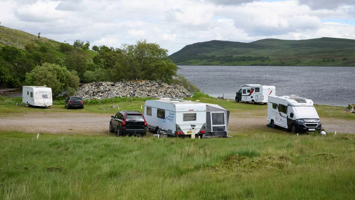 Caravans and motorhomes pitched near Loch Naver