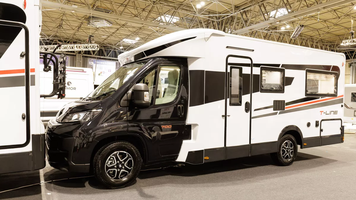 The Roller Team T-Line 700 has a black cab and white coachbuilt body which is decorated with black and red decals.  