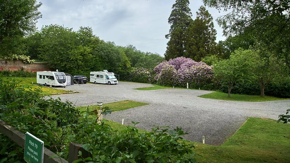 A secluded area of hardstanding with awning pitches