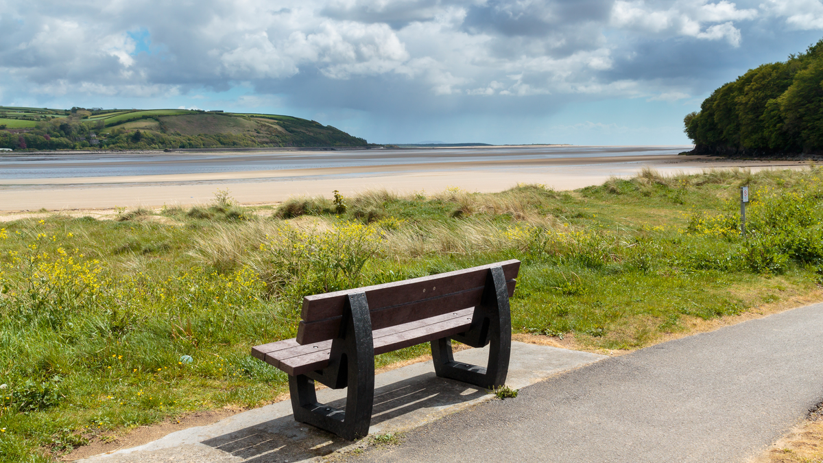 Bench looking out over River Tywi in Llansteffan on the south coast of  Carmarthenshire in Wales.