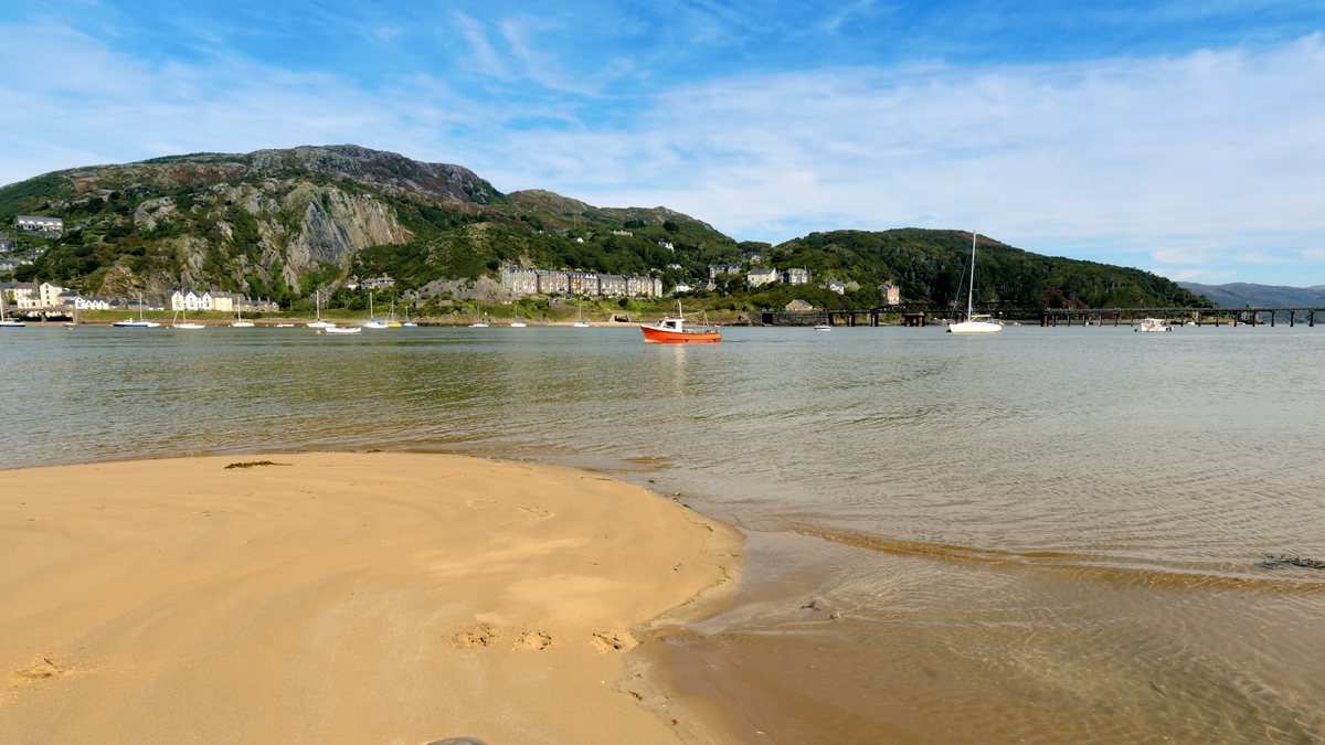Barmouth Bridge across the estuary of the River Mawddach in Wales.