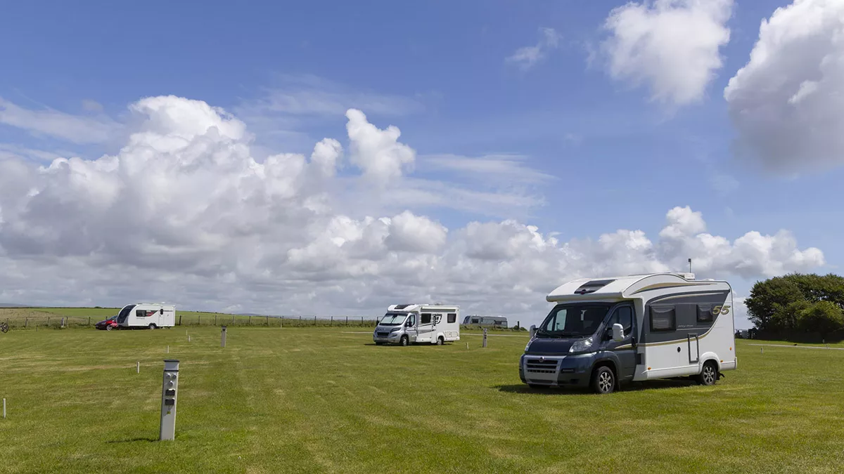 Caravans and motorhomes pitched on electric grass pitches