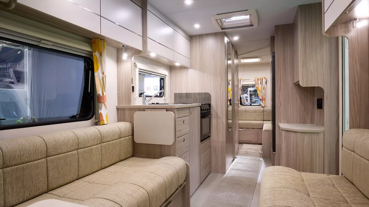 Xplore 585 internal, beige upholstery, wooden furniture, lounge, kitchen, rear lounge, skylights