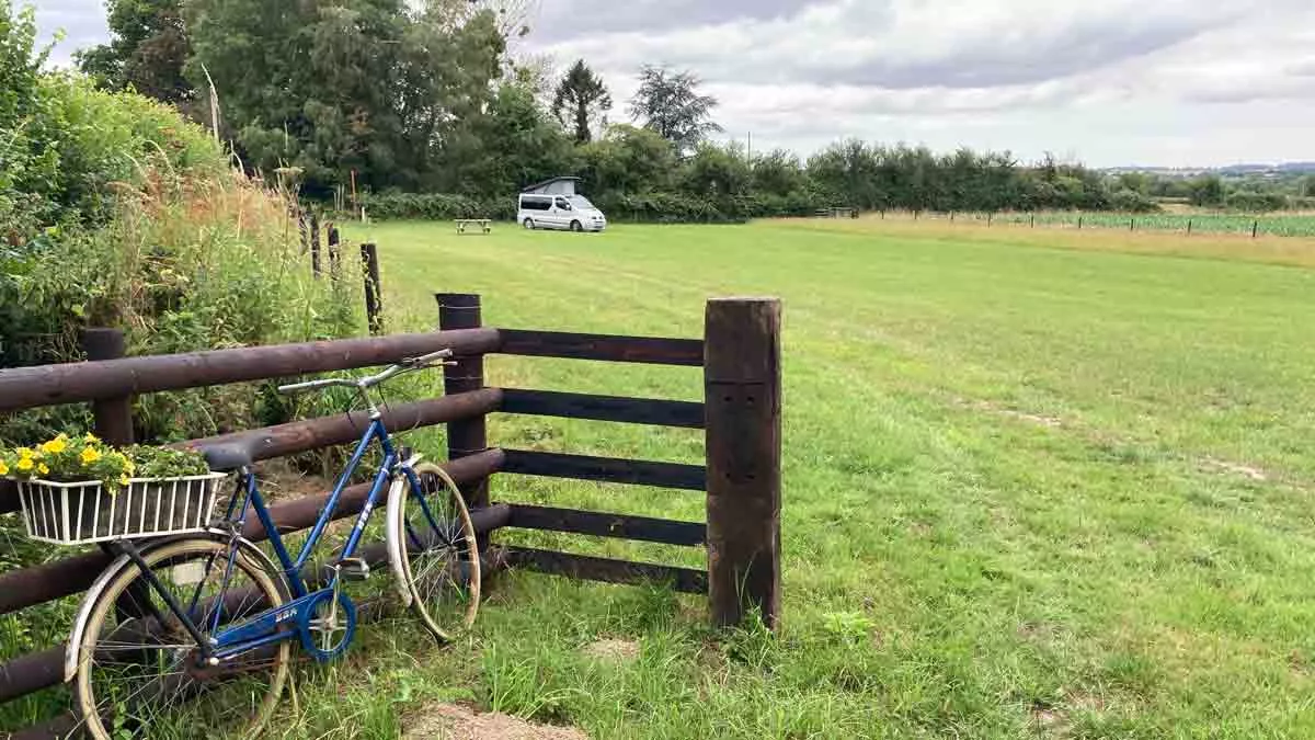 Lower Burrow Farm, TA12 6BS, Langport, Somerset, CL owner, 2026, field, pitch, grass, fence, trees, campervan, bicycle