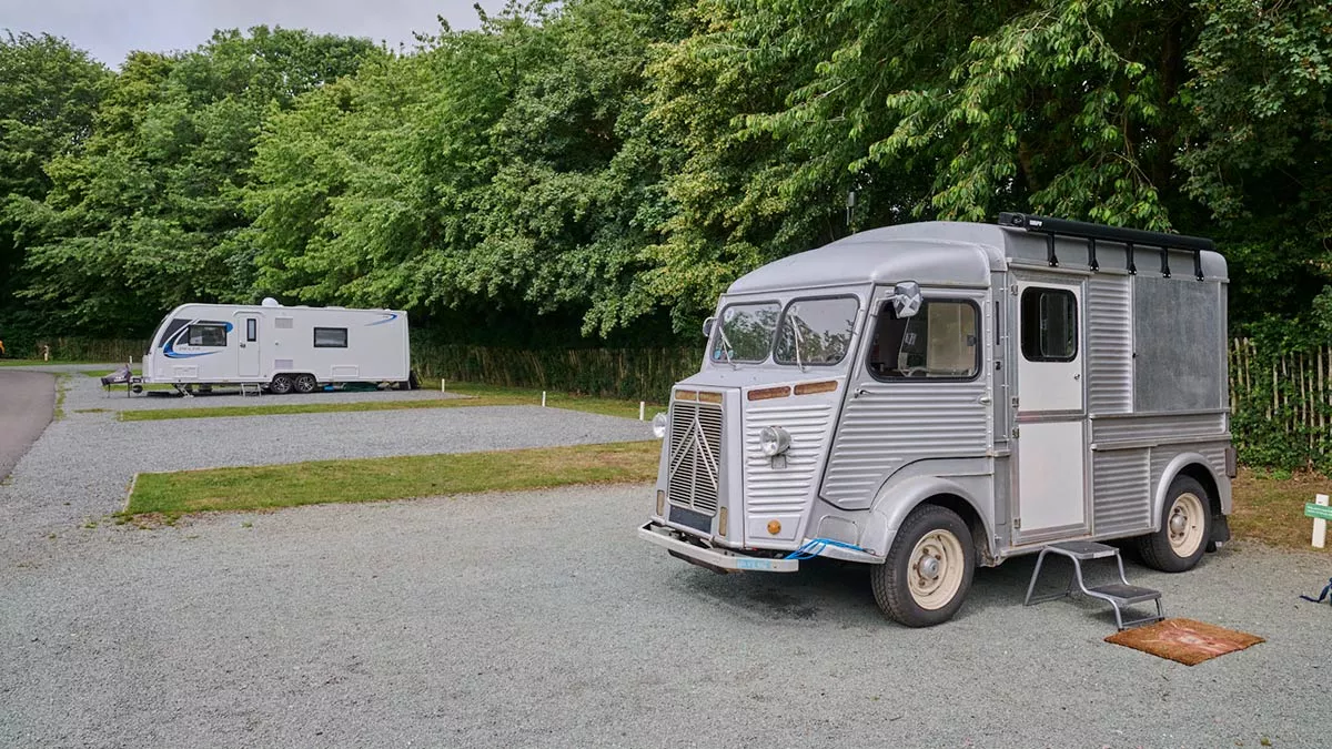 Citroën H camper on a hardstanding awning pitch