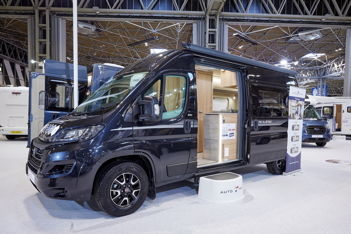 Auto-Trail V-Line 610 Sport exterior, the vehicle is back, the sliding door is open showing into the interior, with a step to gain easy access.