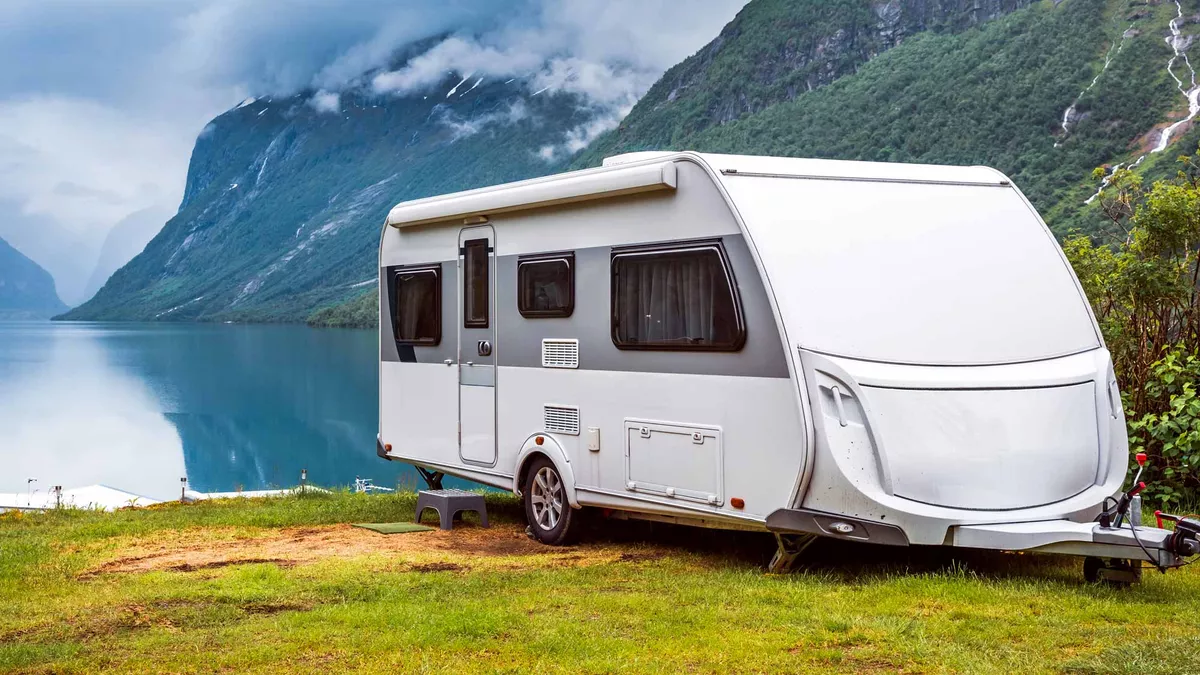 caravan pitched beside a Norwegian lake
