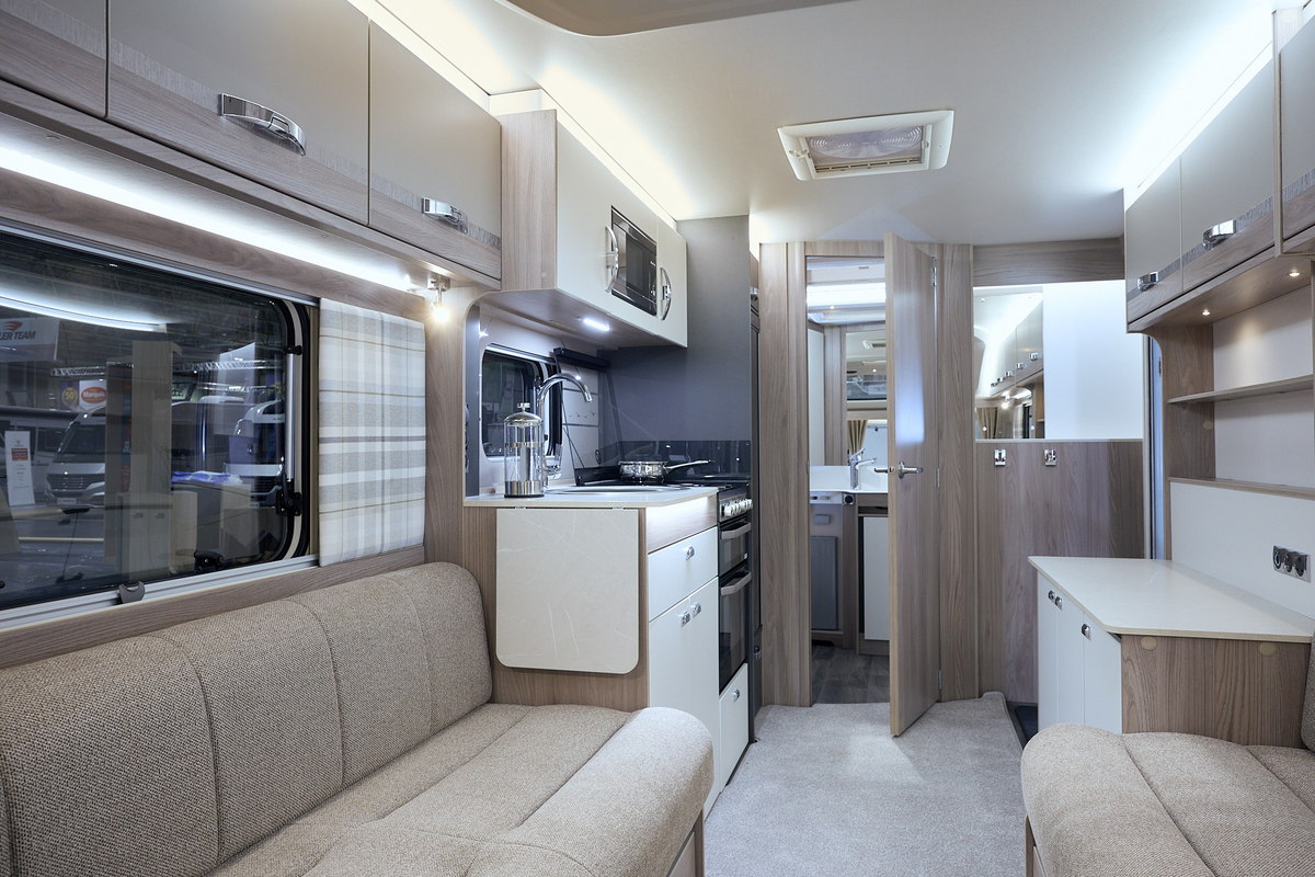 Swift Challenger 480 SE interior, beige upholstery, wood furniture, lounge, kitchen, end washroom, skylight