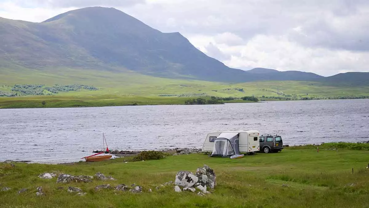 Caravan pitched on the shore of Loch Naver