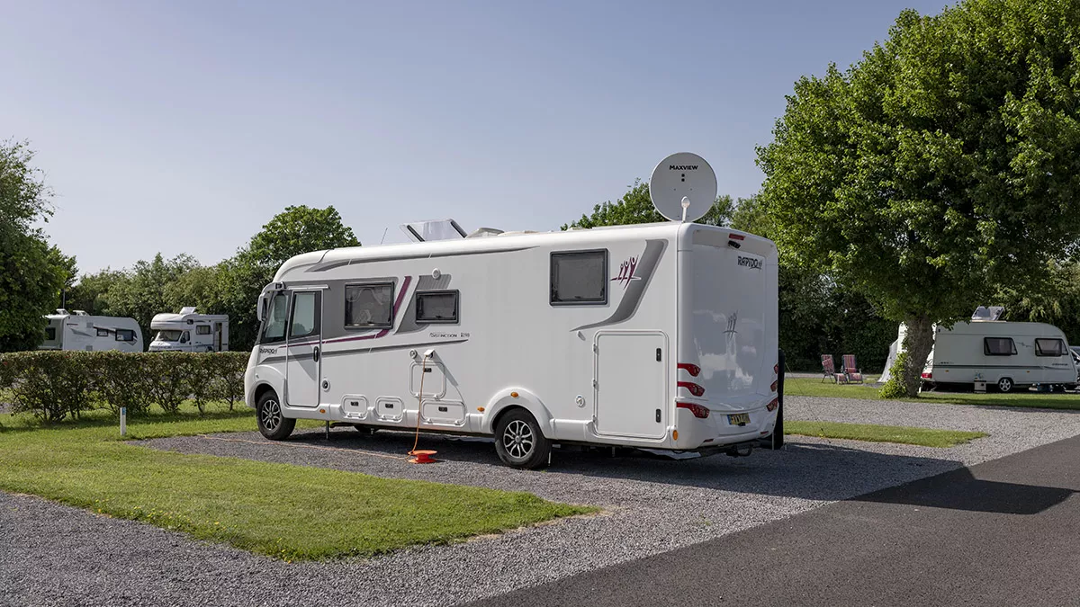 Motorhome pitched on a well-maintained hardstanding touring pitch