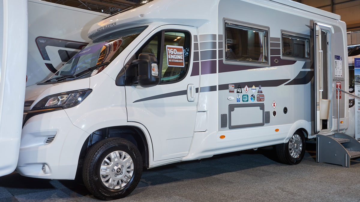 Close up view of a white motorhome in an exhibition centre