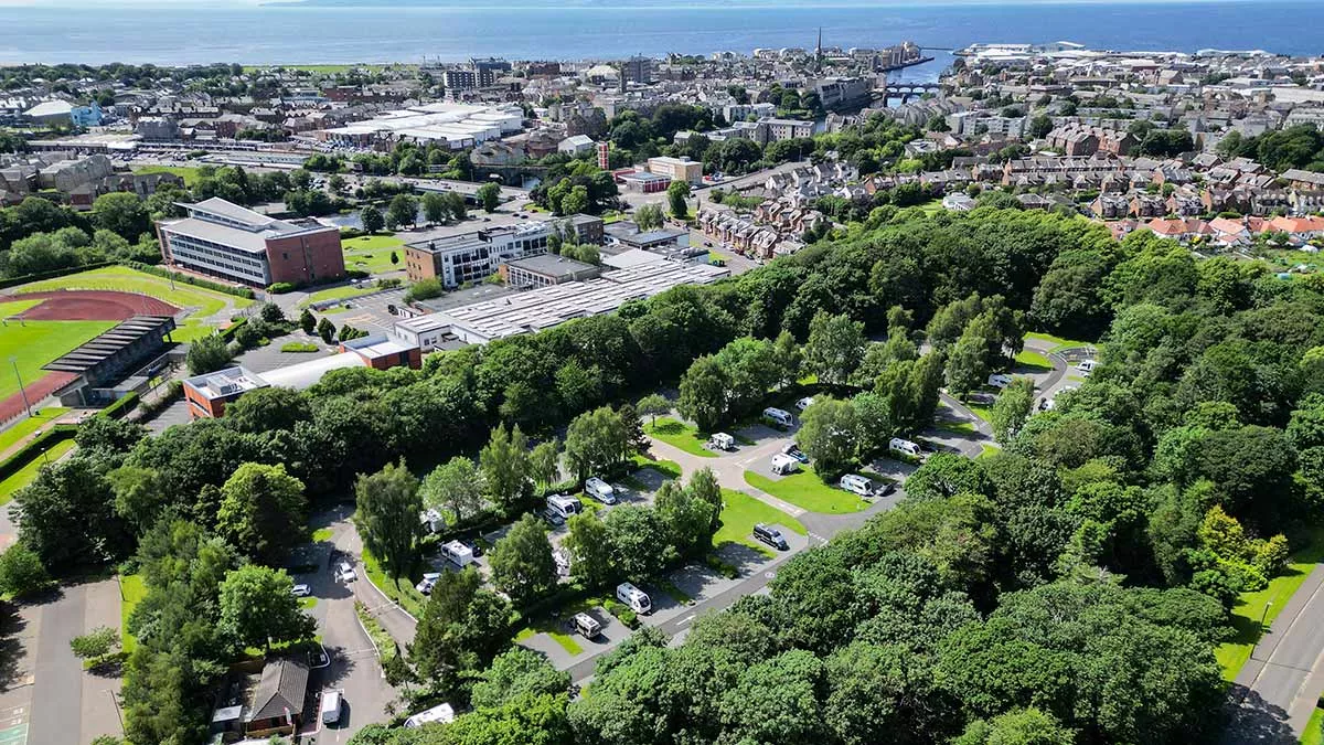 Aerial view of Ayr Craigie Club Campsite with the sea in the background