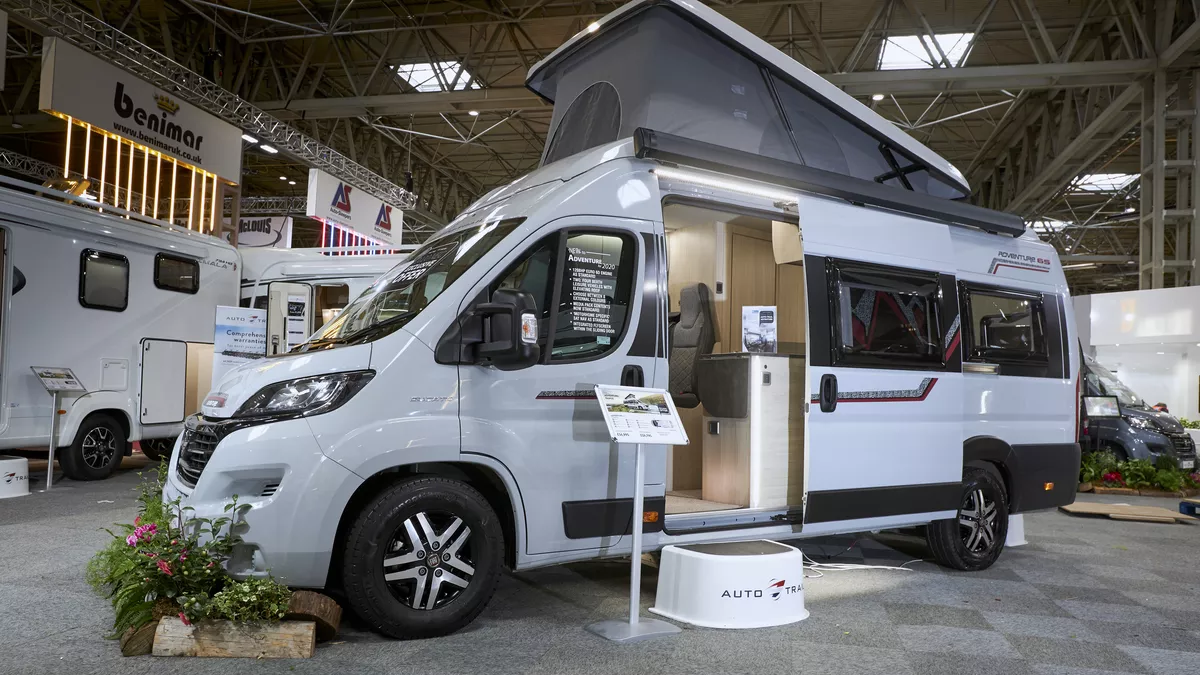 Exterior, rising roof, white van conversion.