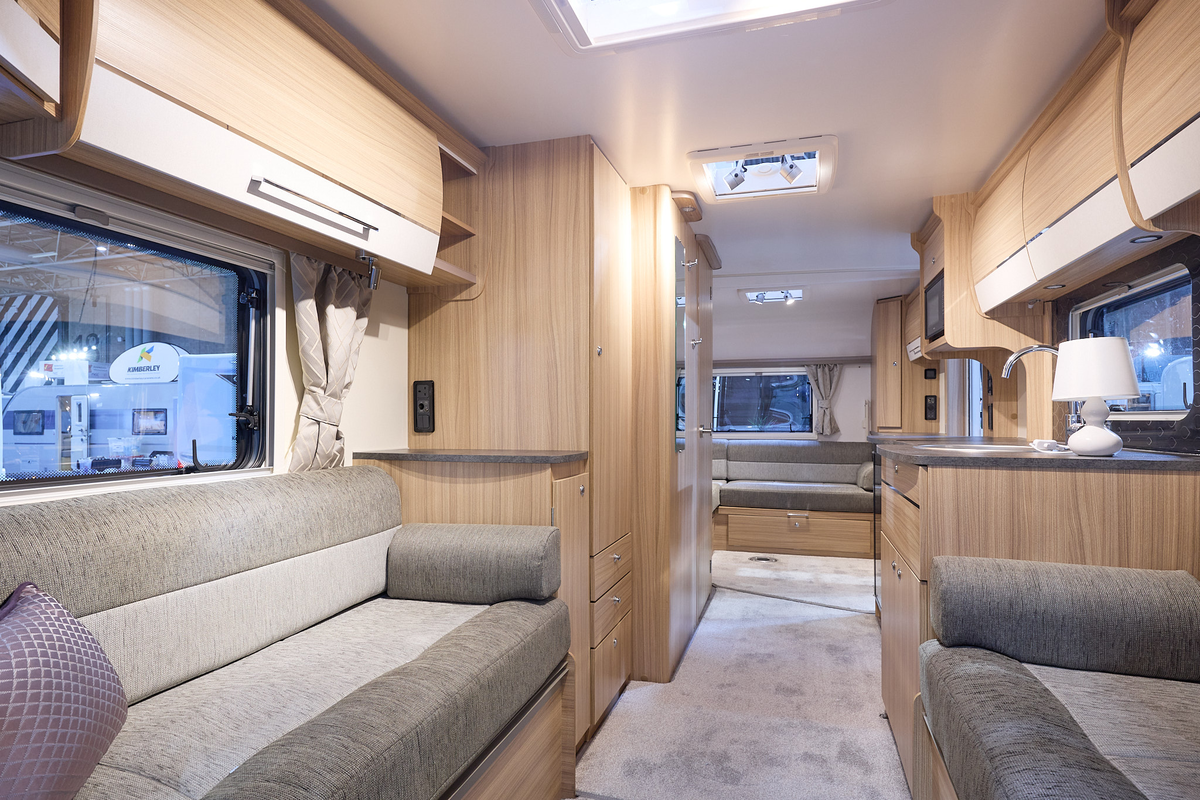 Bailey Pegasus Grande SE Ancona interior, two tone grey upholstery, wood/cream overhead lockers, lounge, kitchen, rear lounge, three skylights
