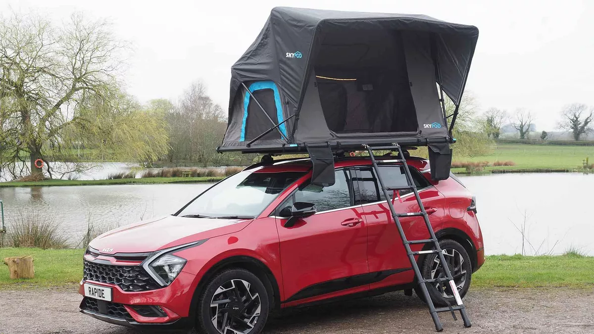 SkyPod roof tent on a red car