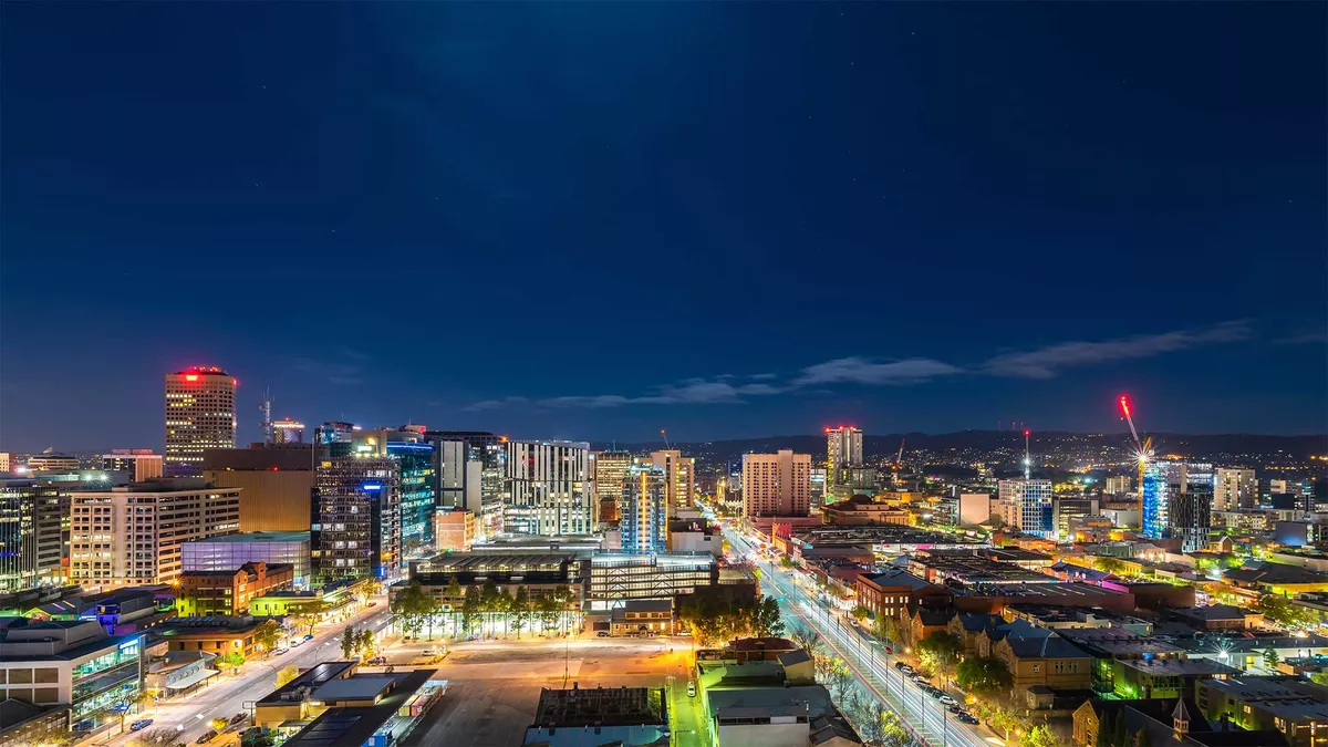 Adelaide city at night with the city lights glowing under the dark sky
