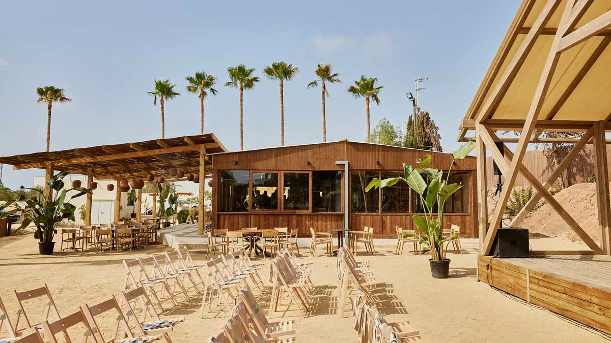 beach cafe lined with palm trees