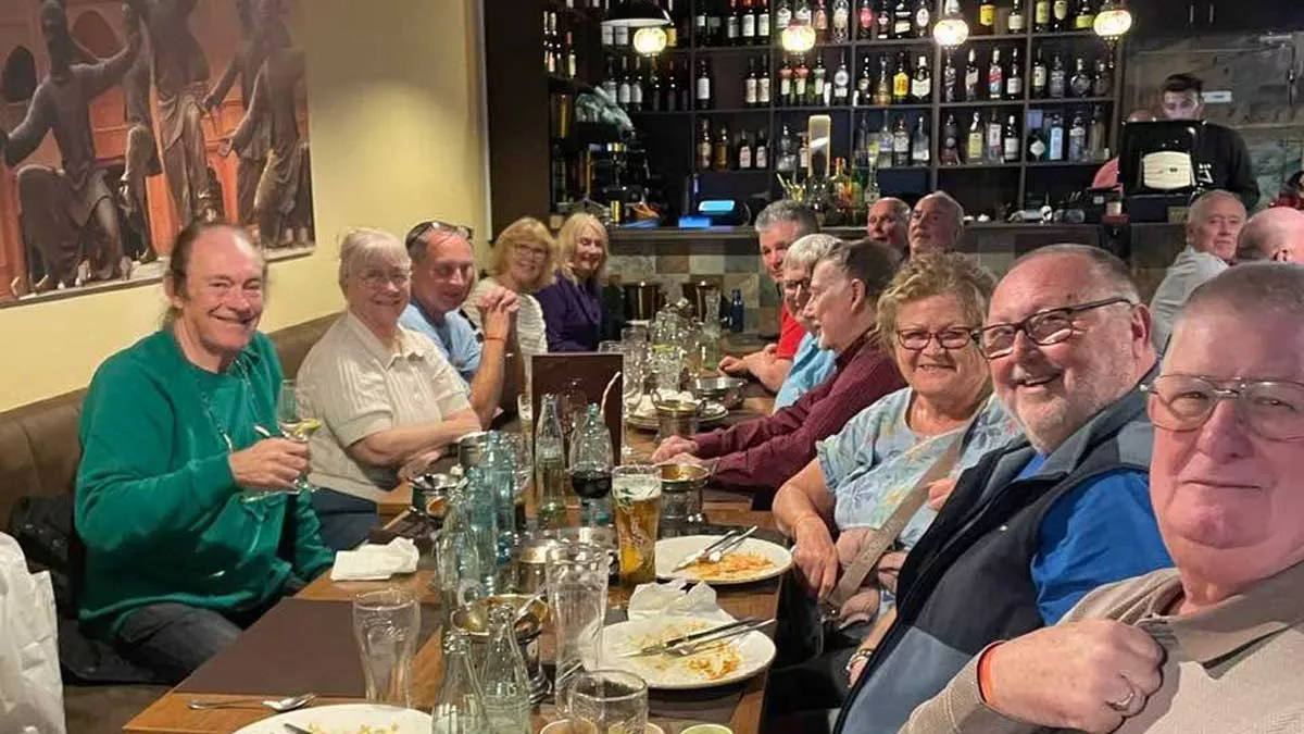 holidaymakers enjoying a night out and meal together