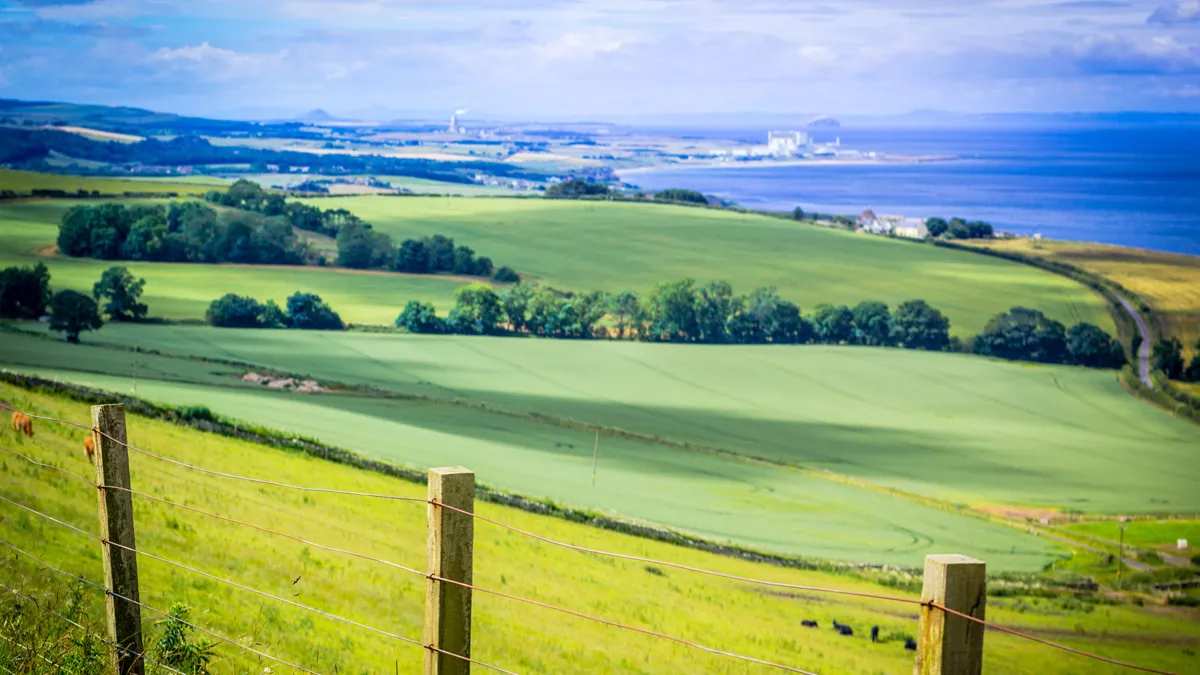 looking out over rolling green hills to the seaside near Dunbar, East Lothian