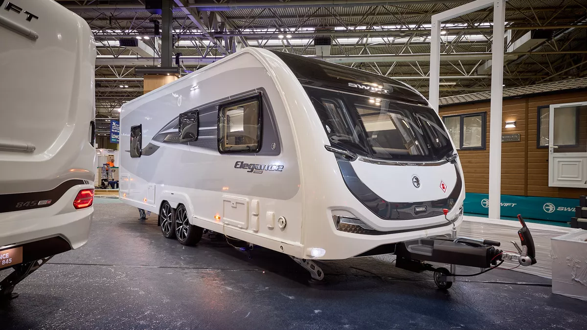 Swift Elegance Grande 850 is white with black decals and grey side panels.  Its corner steadies are down.