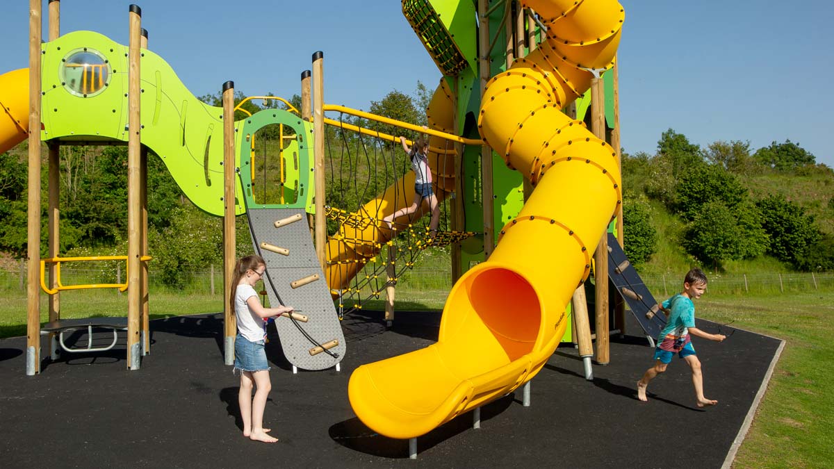 Children playing on a climbing frame in the sunshine in Scarborough