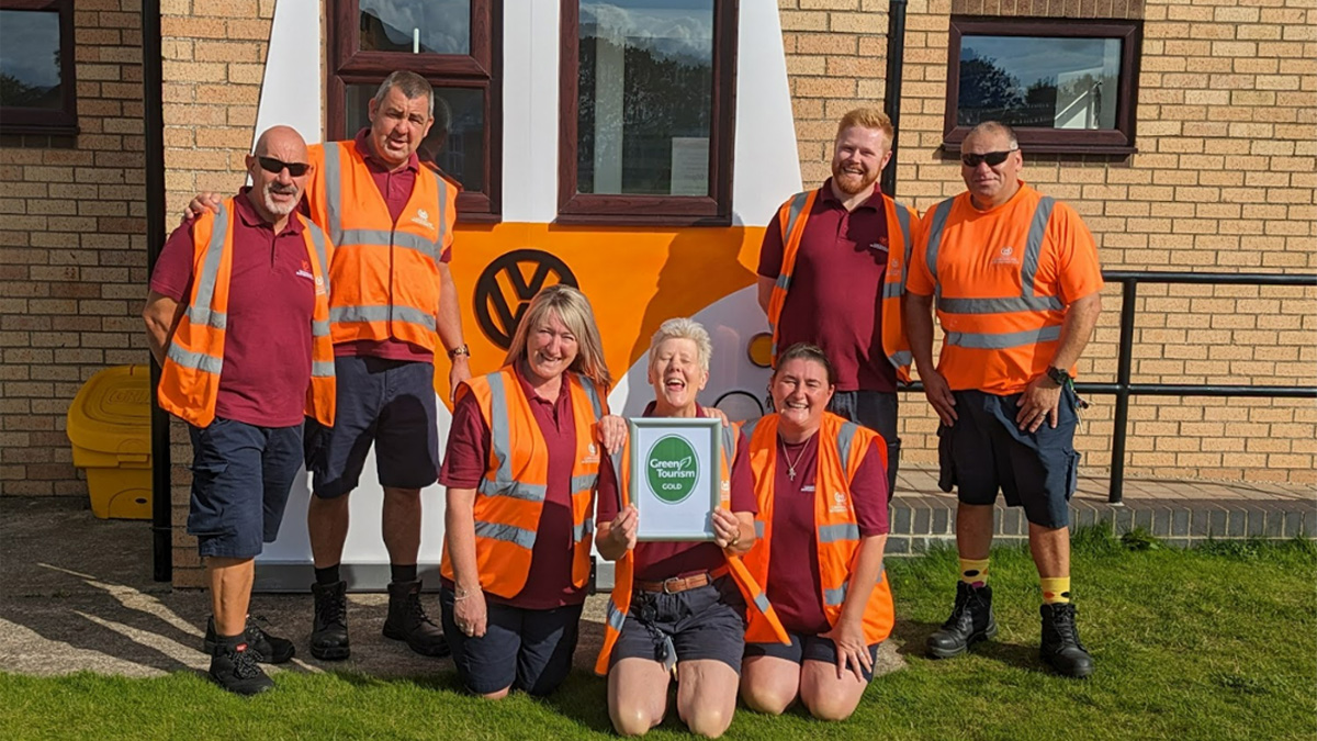 Site staff celebrating with award