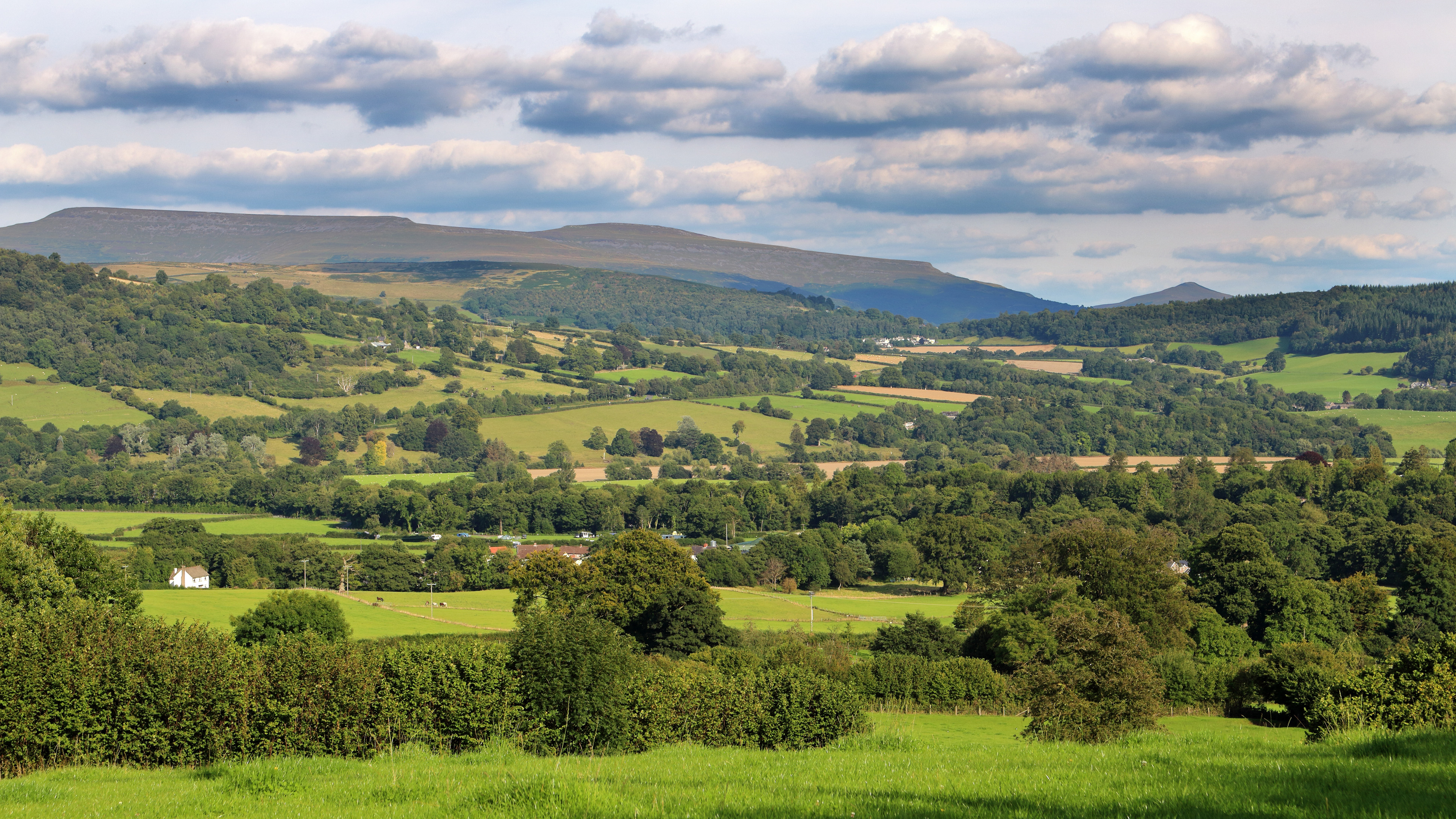 Rolling green hills in Powys near Brecon Beacons in Wales.i