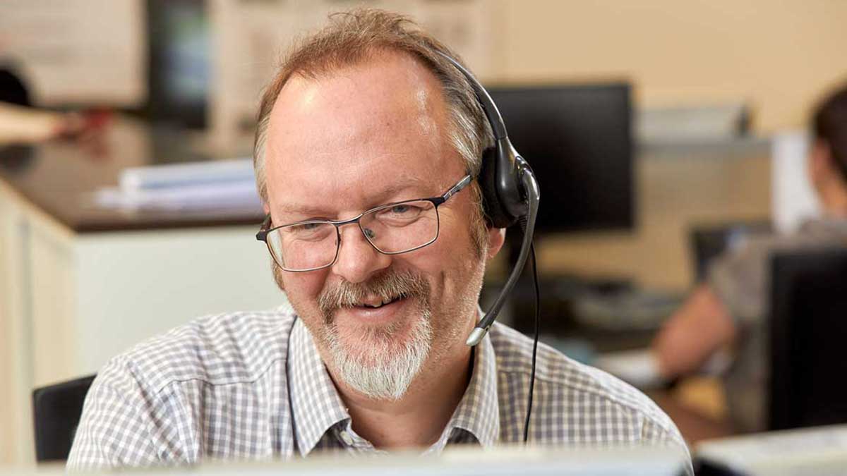 Man wearing headset on phone