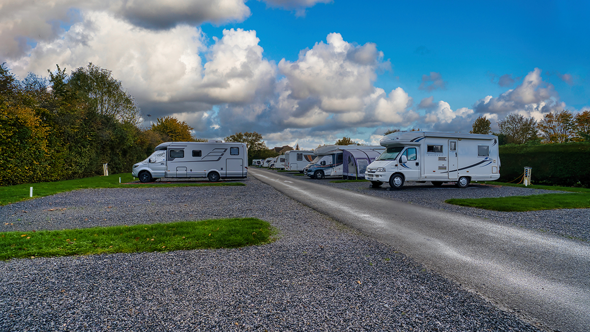 A campsite landscape shot with motorhomes on pitches