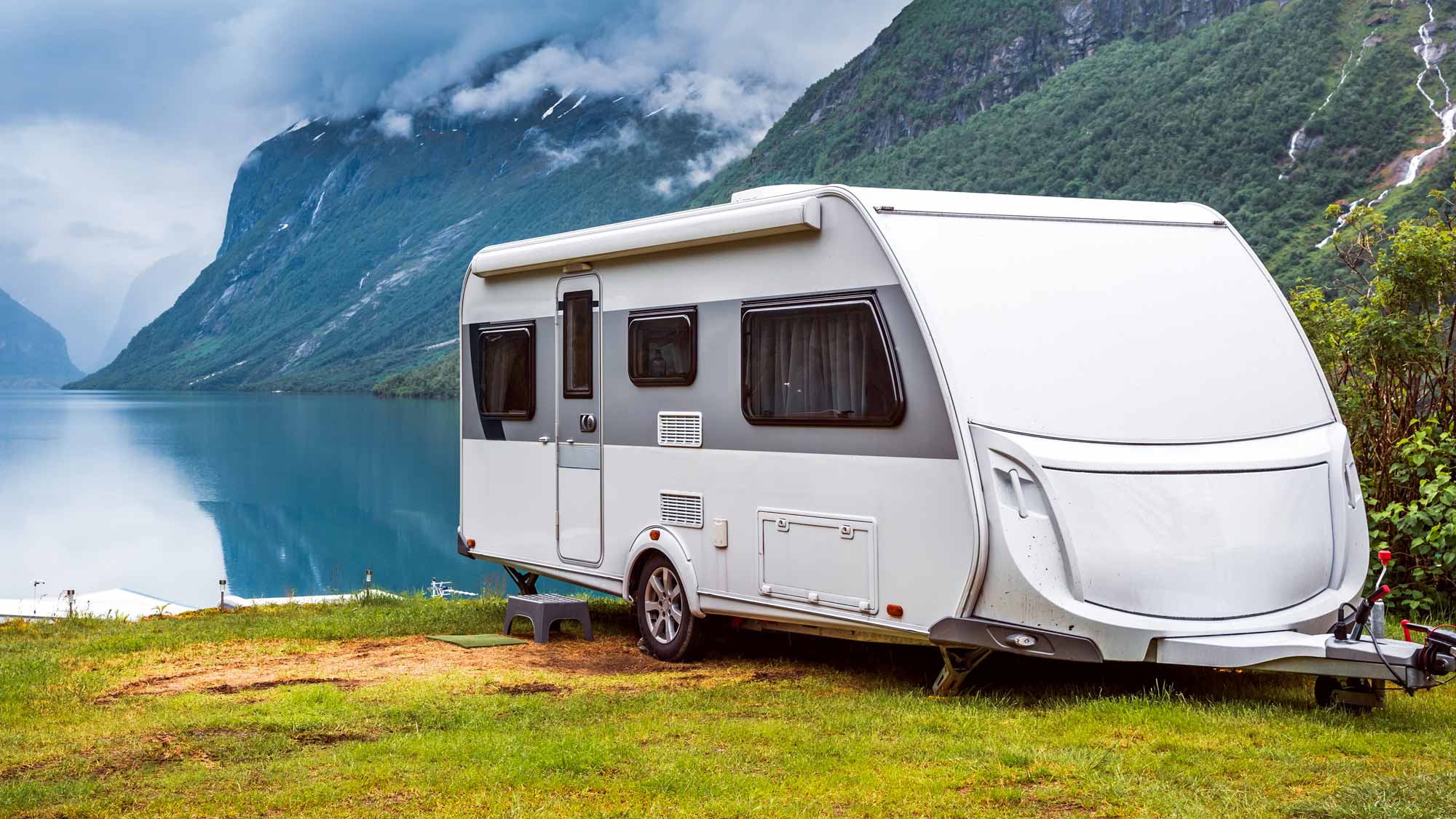 caravan pitched beside a Norwegian lake