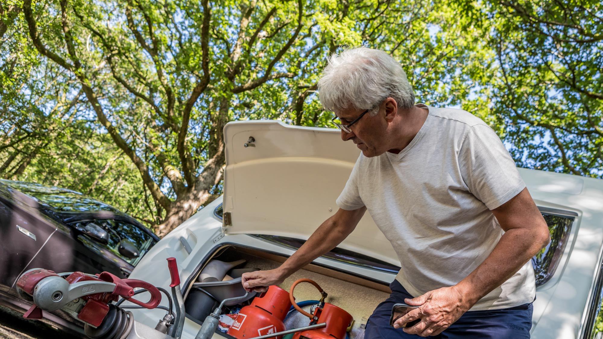 Man checking his caravan
