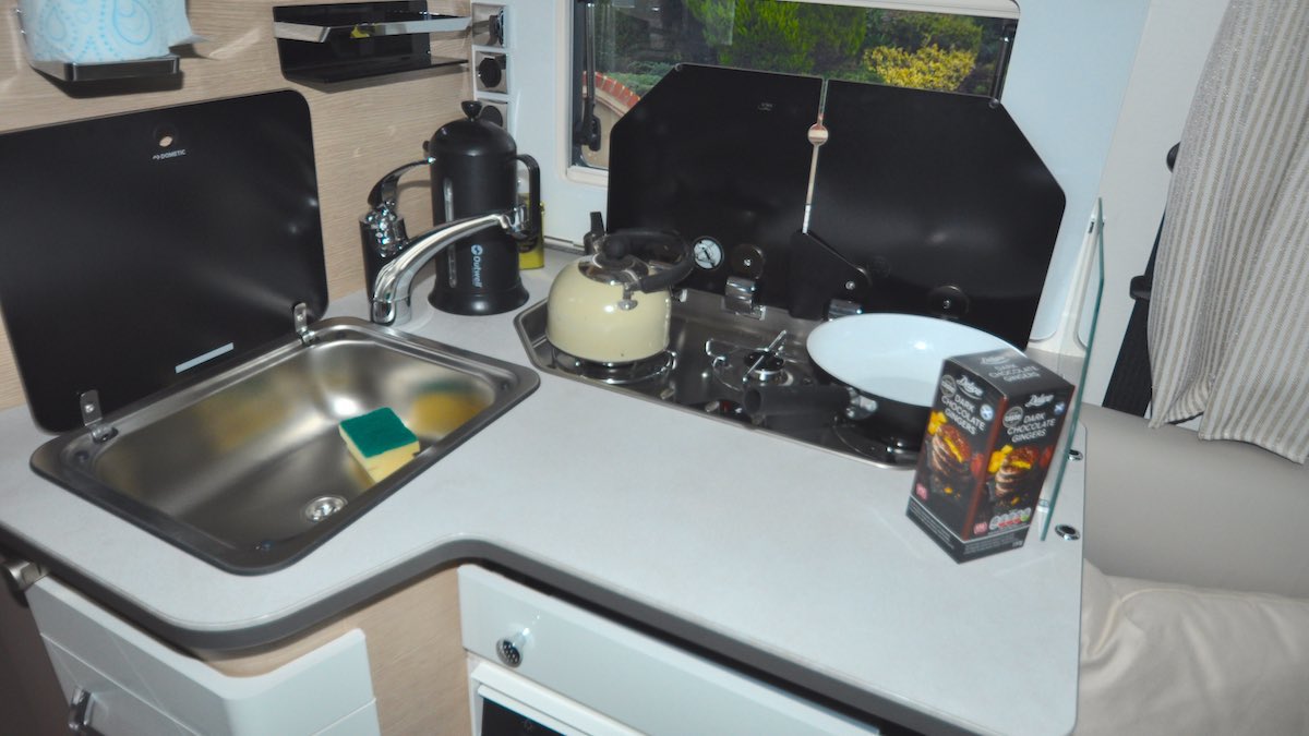Motorhome kitchen with three ring hob and sink