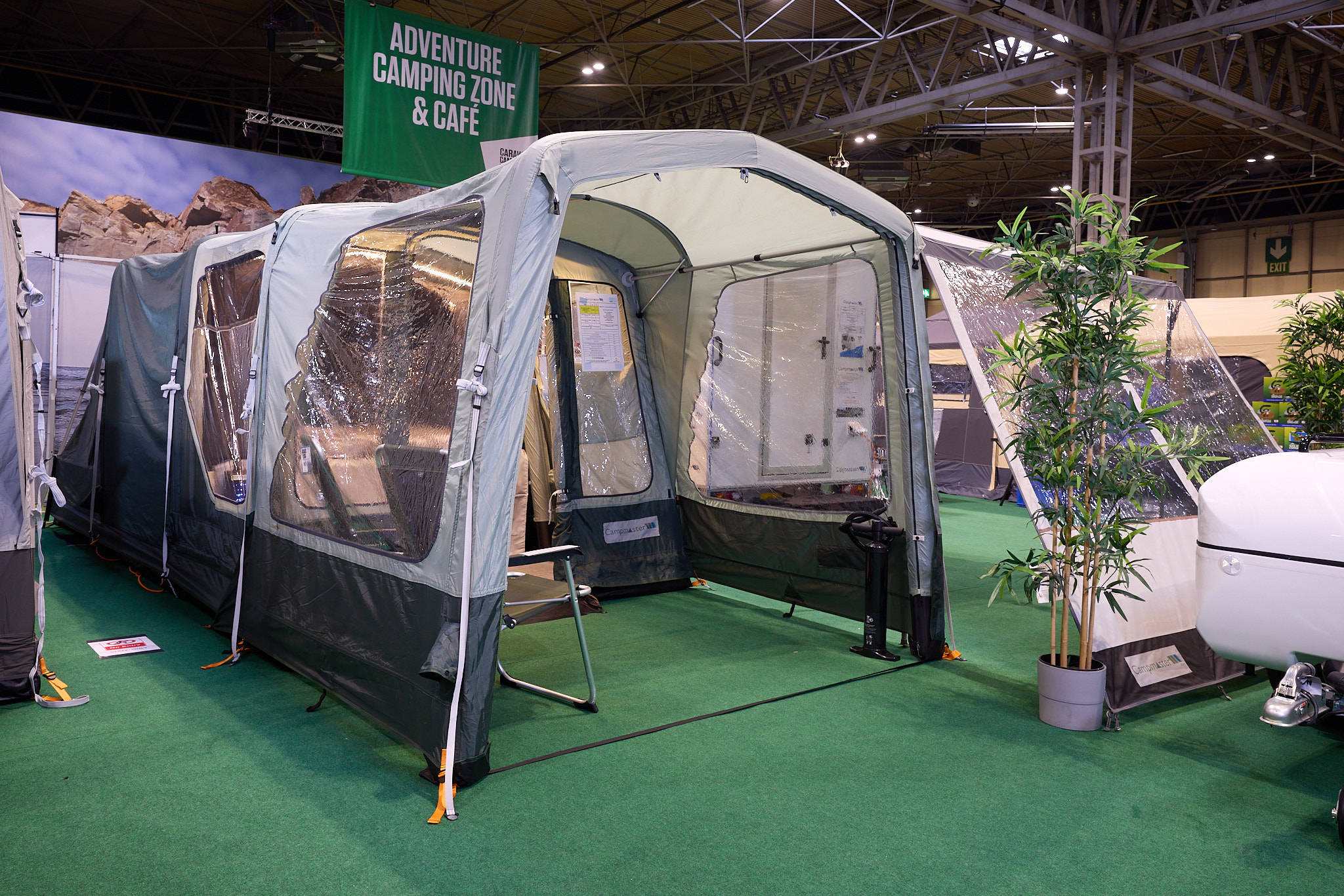 Campmaster 600 Limited edition has cream and brown canvas.  The doors are open revealing the interior.  There are two camping chairs inside the main tent