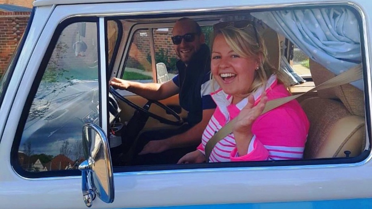 Club members Phil and Sophie Aldridge in their blue Volkswagen campervan