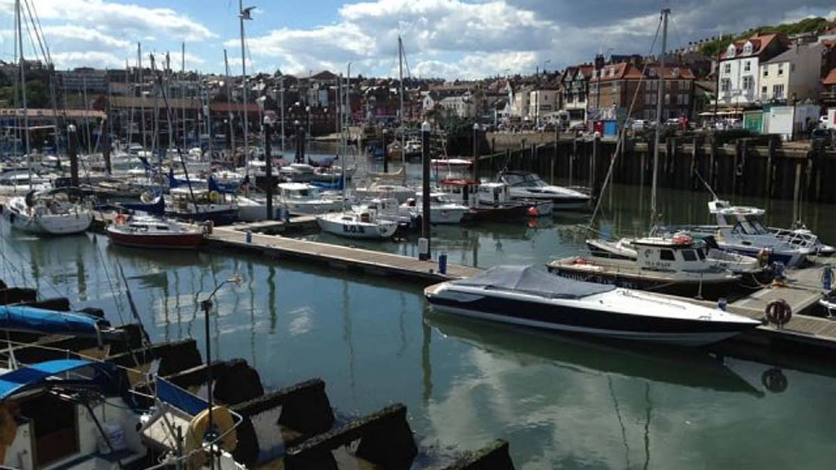 Boats on clear blue water in Scarborough Harbour