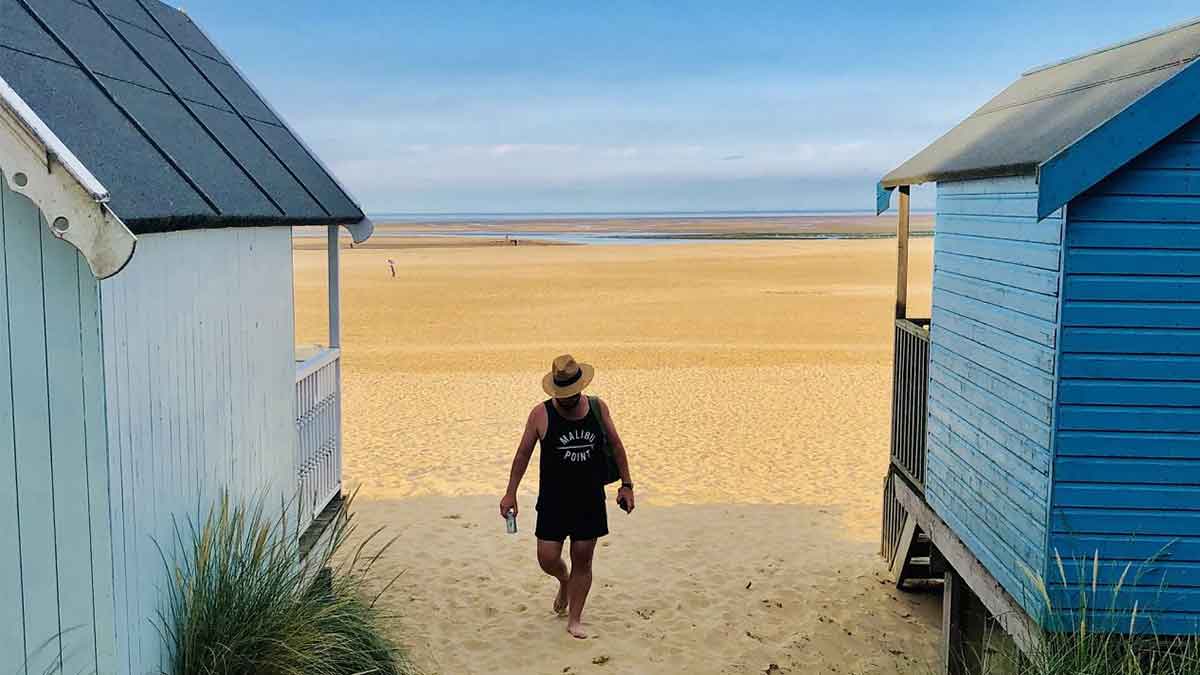 Beach huts on sandy beach at Well on sea, Norfolk