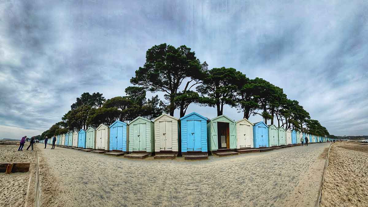 Multi coloured beach huts on Avon Beach