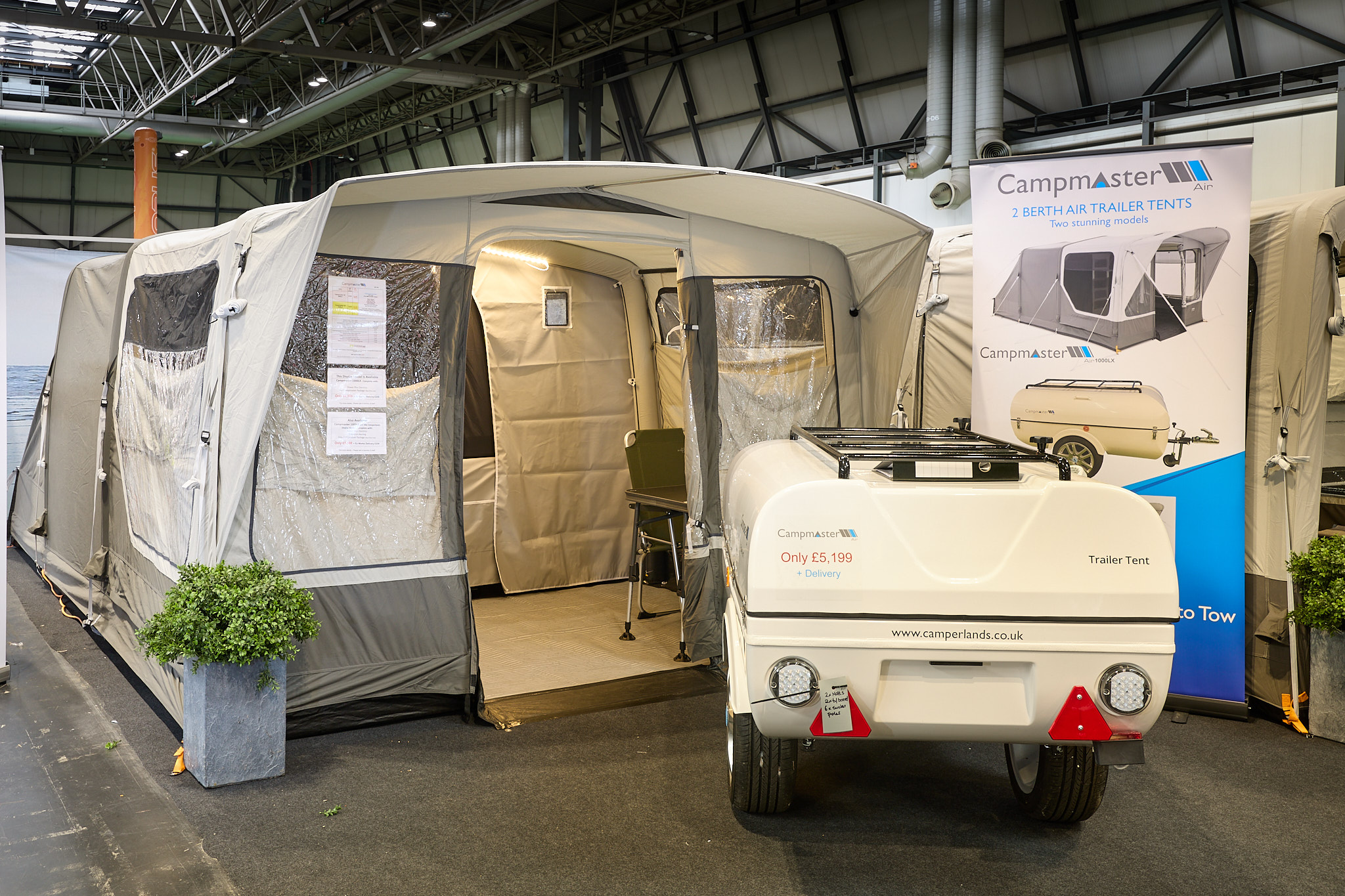 Campmaster AIR 1000 LX exterior, brown and cream canvas with the door open showing into the interior.  The travelling trailer is shown in cream