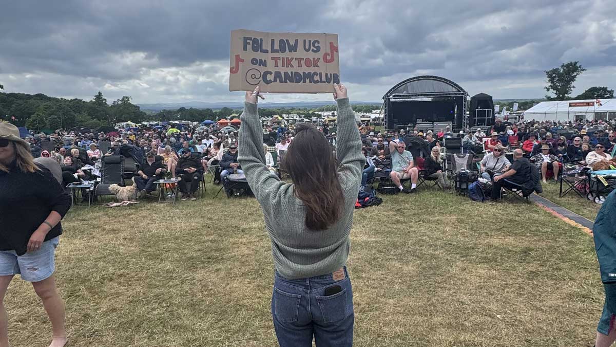 Sign reads: Follow us on TikTok @candmclub