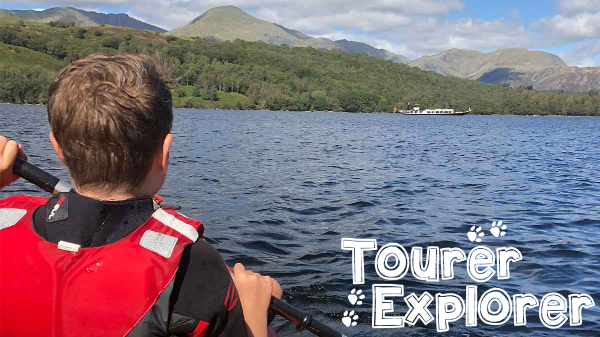 Boy kayaking on river with Tourer Explorer logo on bottom right hand side
