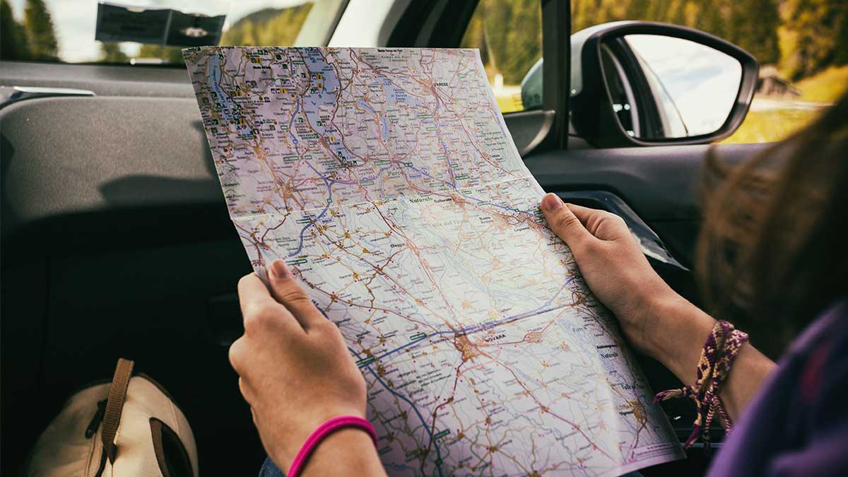 Hands holding a map 