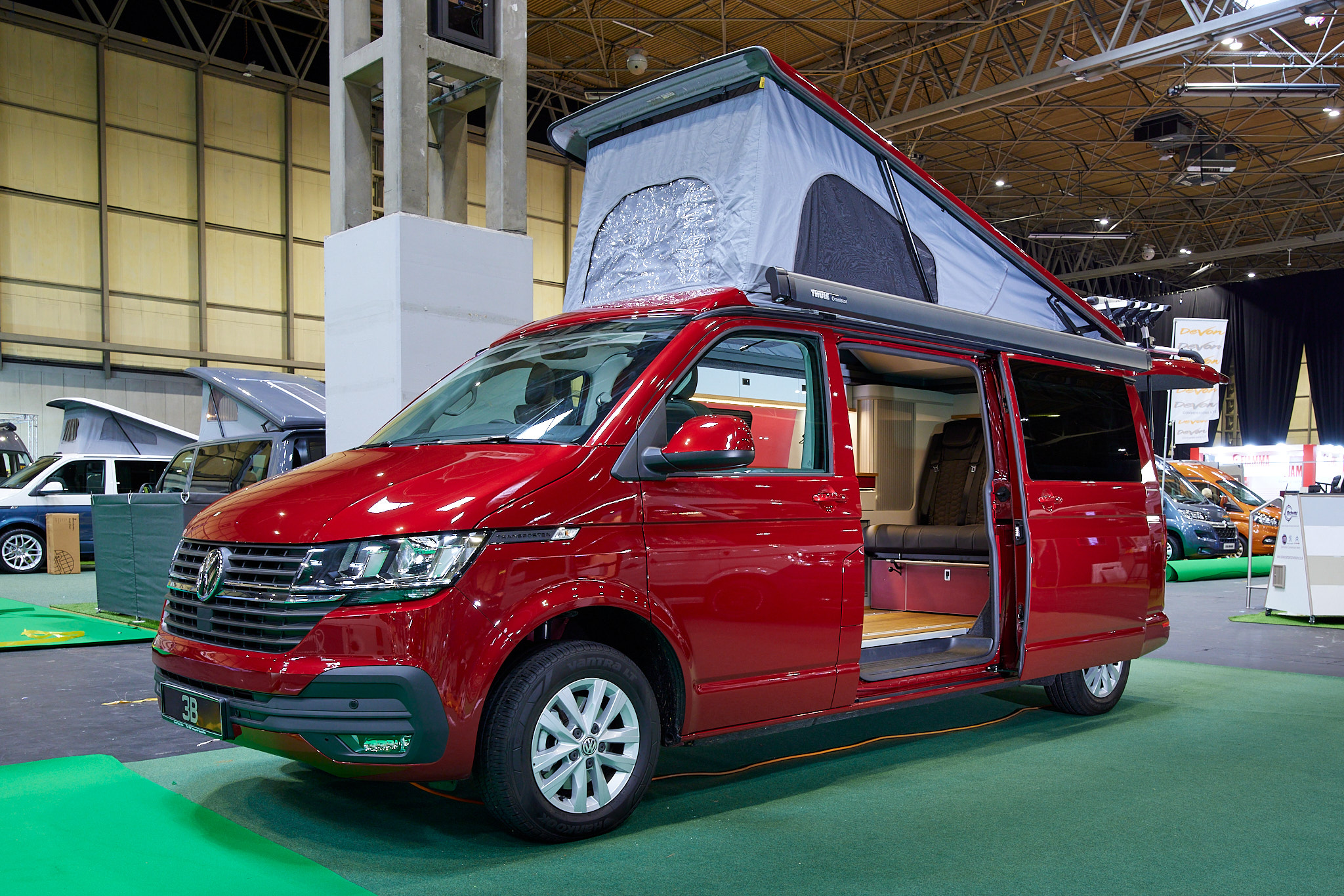 Red campervan, sliding door, raised roof