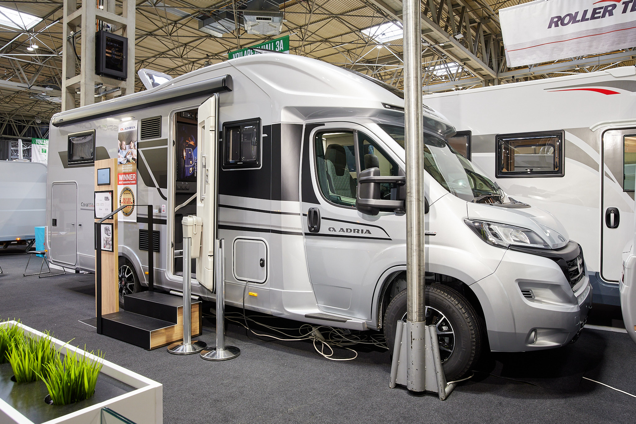 Coachbuilt motorhome, white, black stripe