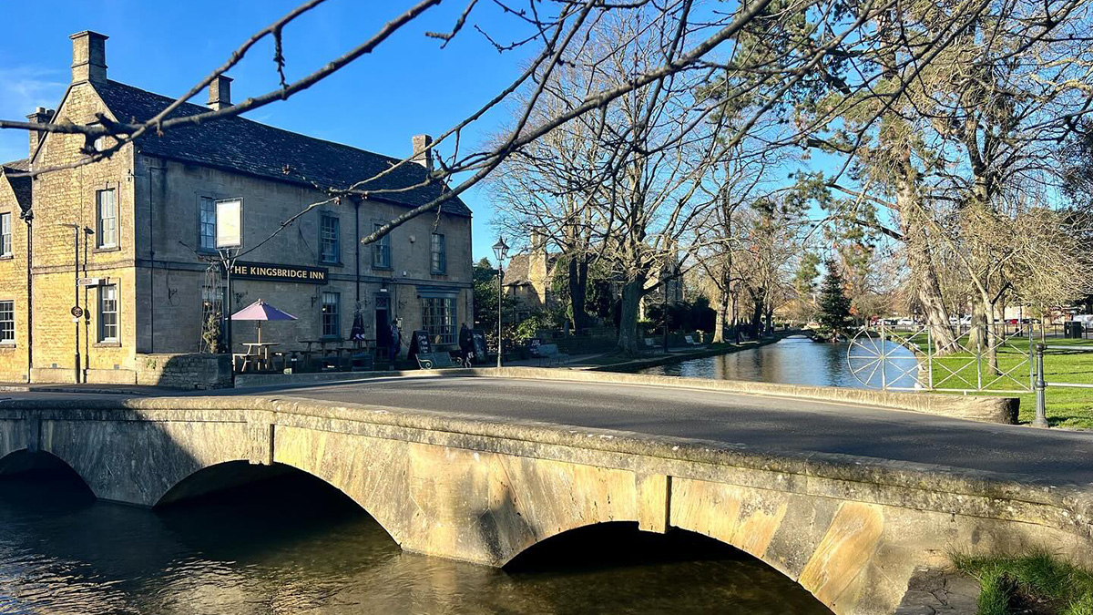 stone bridge over the river at Bourton on the Water in the Cotswolds