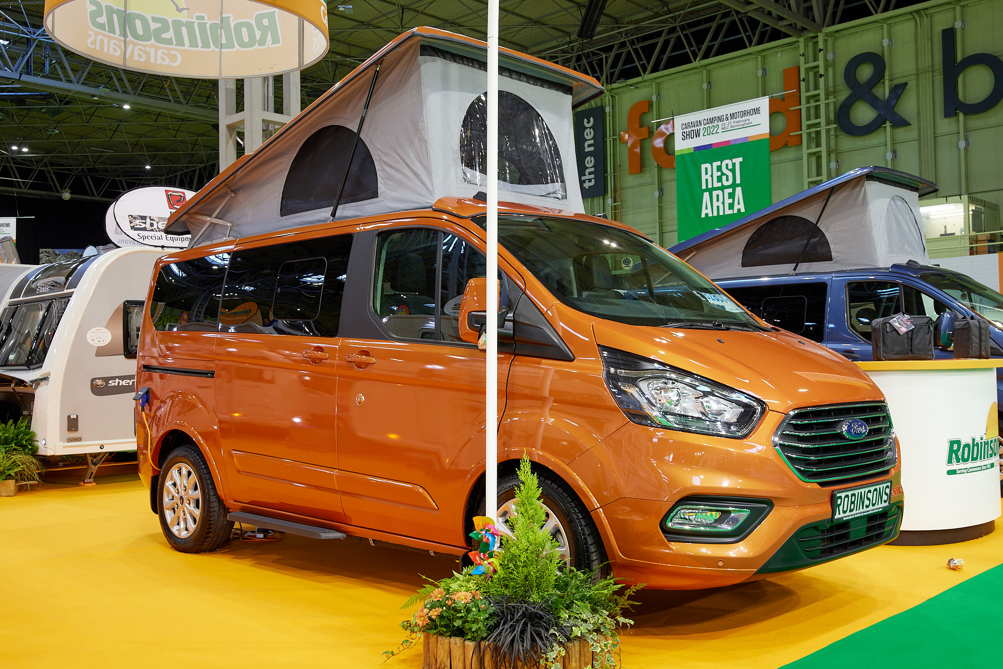 Orange campervan, rising roof