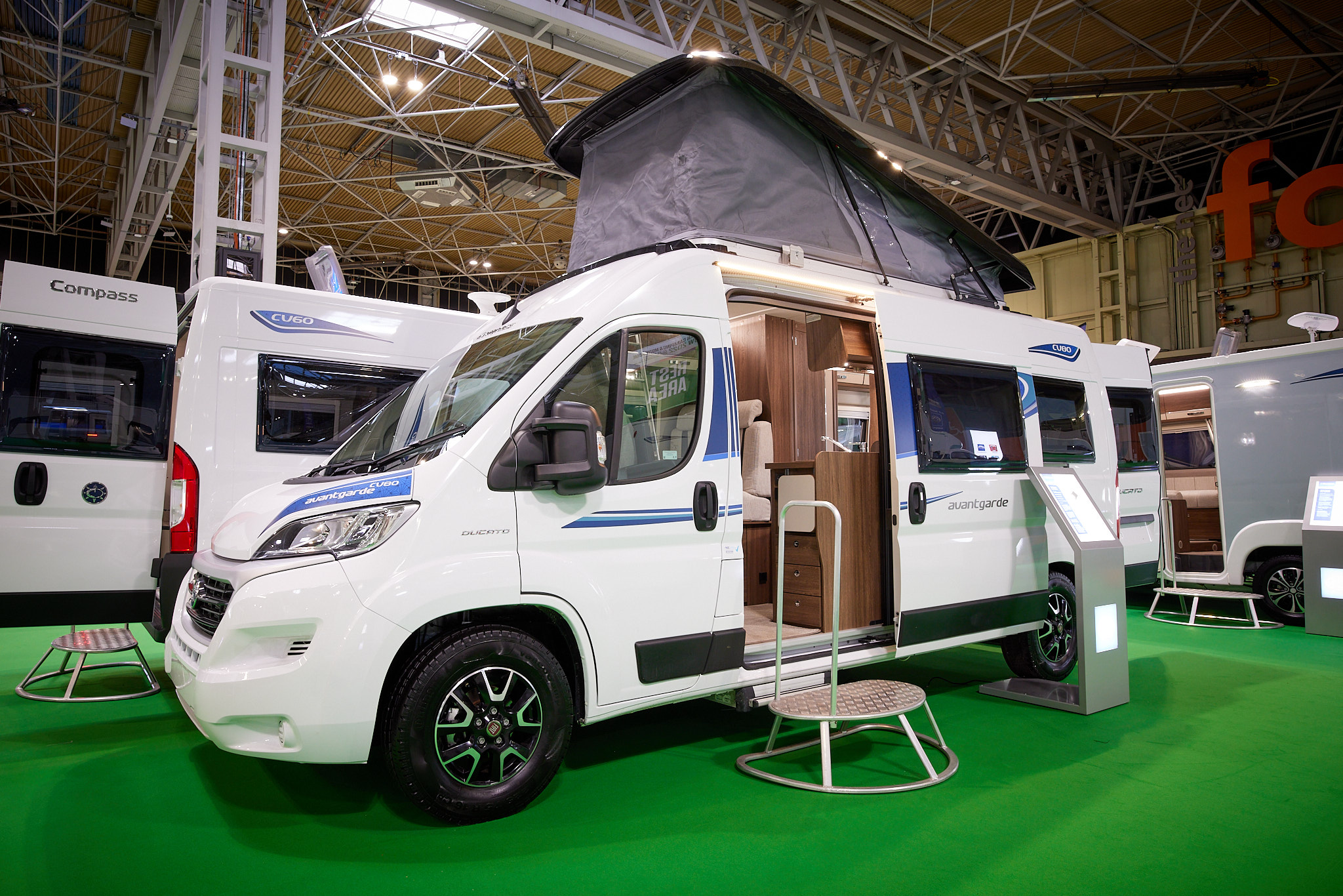 Van Conversion exterior, white, rising roof