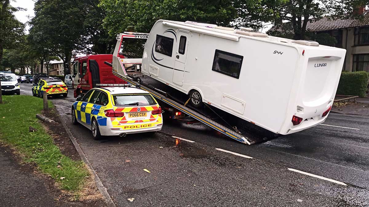 Stolen caravan being towed with police escort