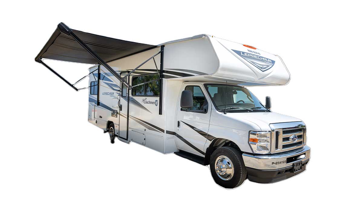A white with dark colour pattern stripes Road Bear overcab motorhome. Class C 26-28. With an canopy awning pulled out. With a white background. 