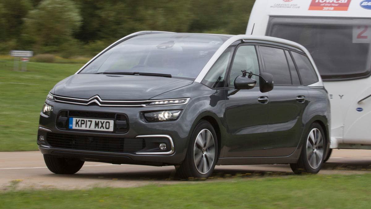 Black Citroën towing a caravan