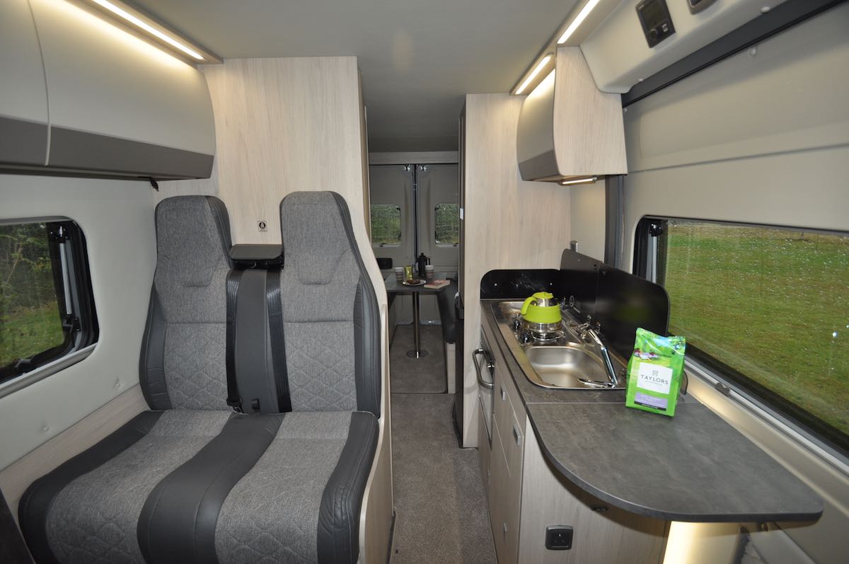 Back to front view of Auto-Trail Adventure 65 LB campervan with seating, kitchen